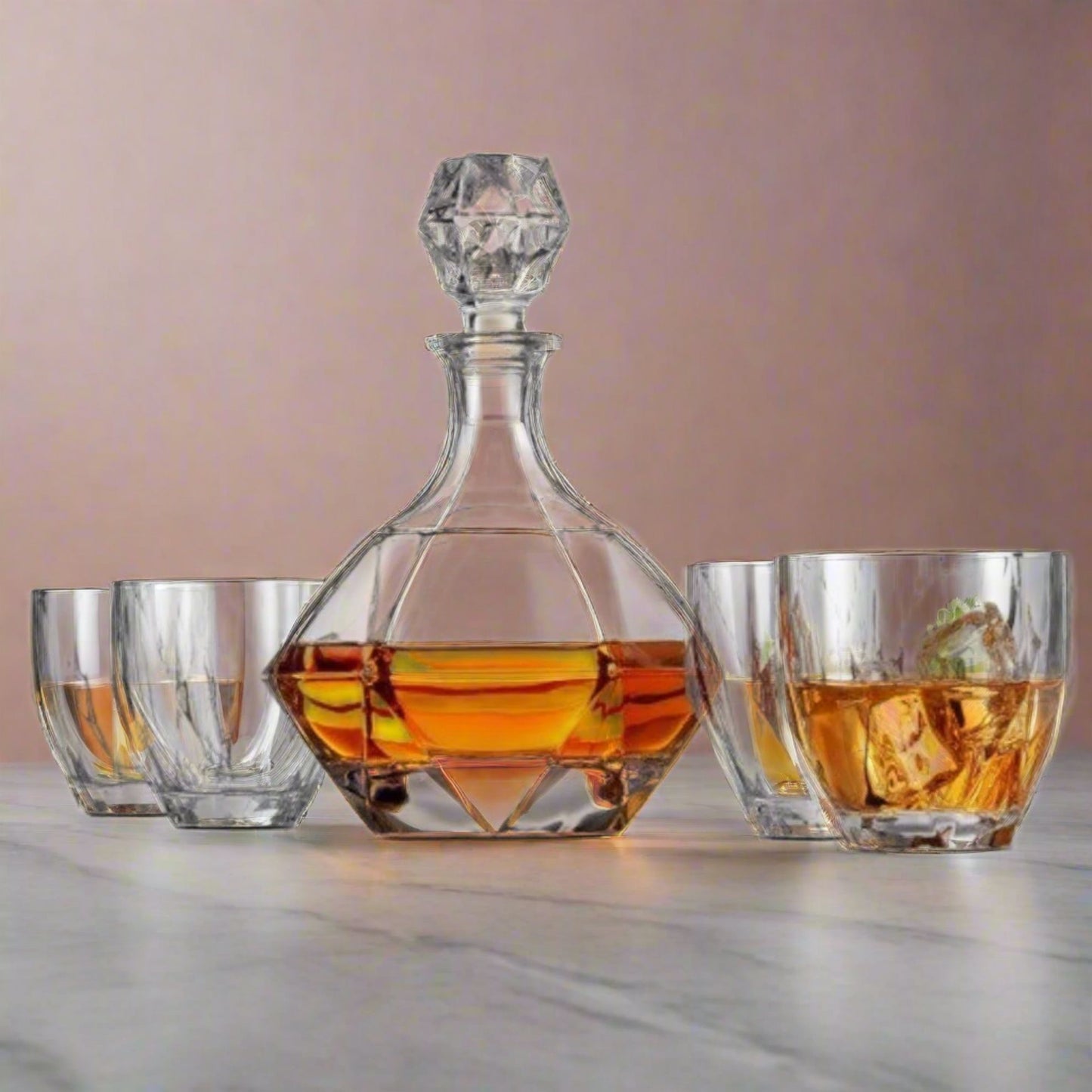 Crystal decanter with geometric design filled with amber liquid, accompanied by three glasses on a light surface.