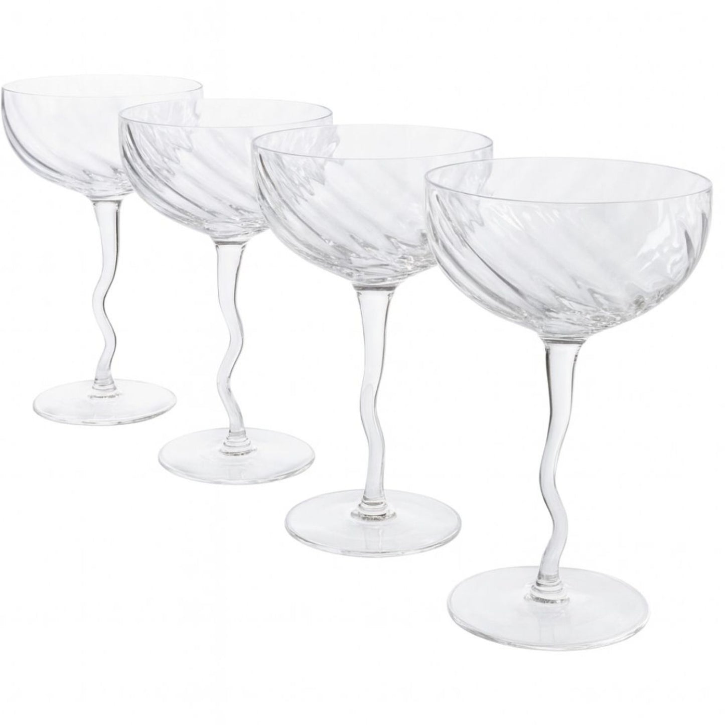 Set of four clear glass coupe glasses on a white background