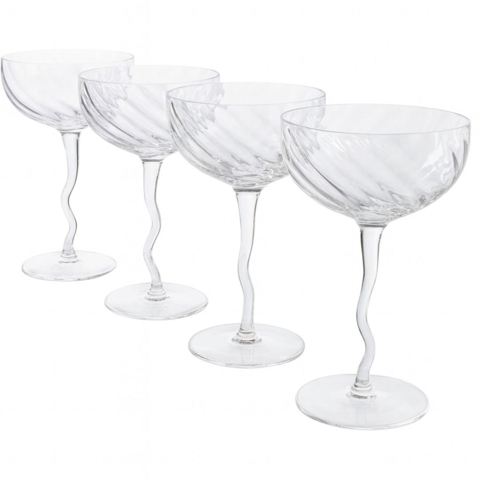 Set of four clear glass coupe glasses on a white background