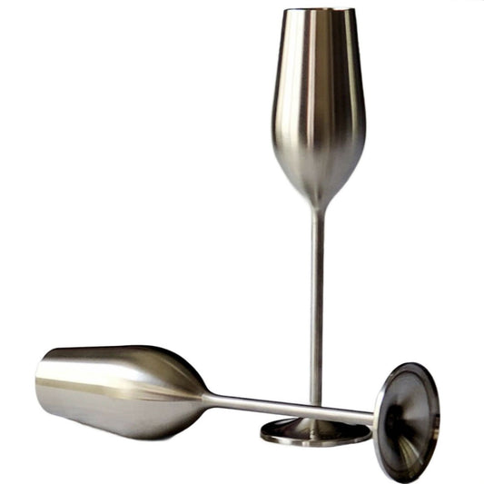Metallic wine glass and spoon set on a white background