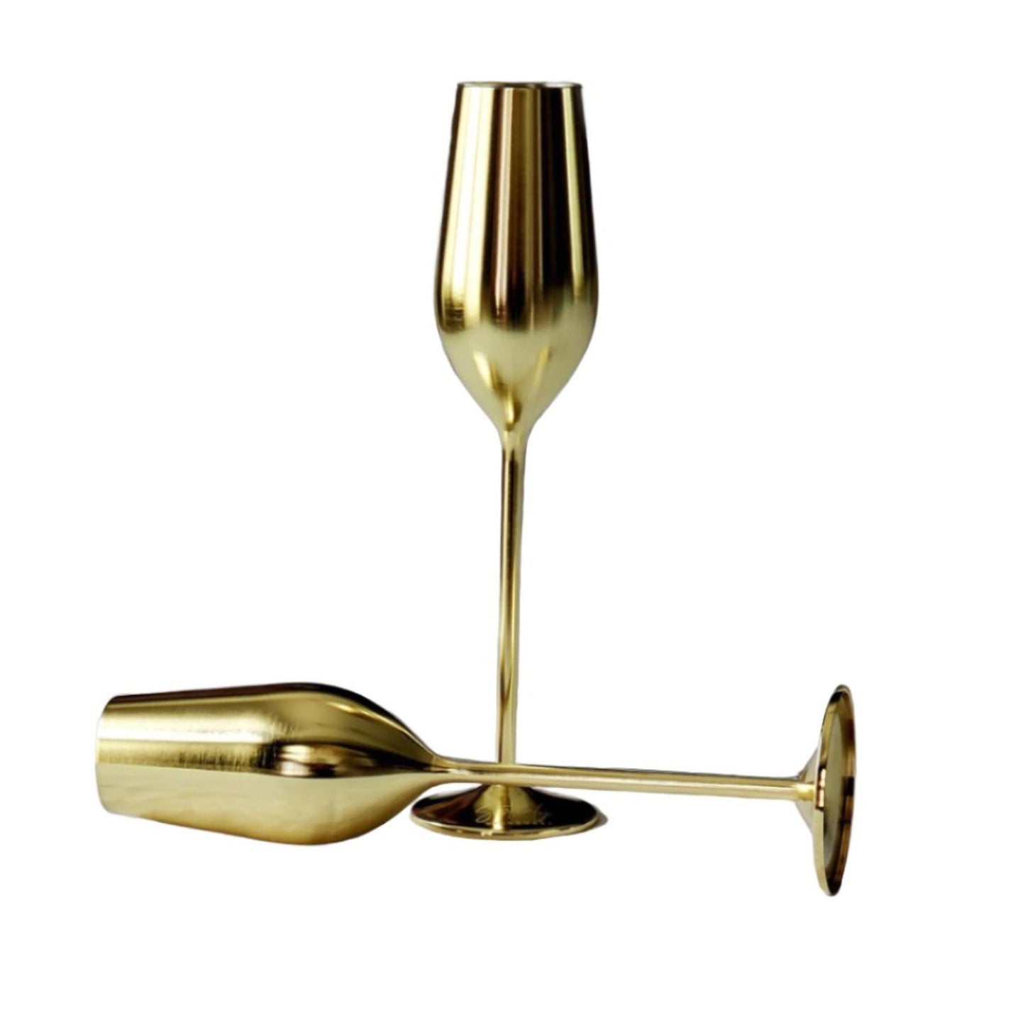 Two gold champagne flutes on a white background