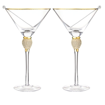 Two martini glasses with gold accents on a white background