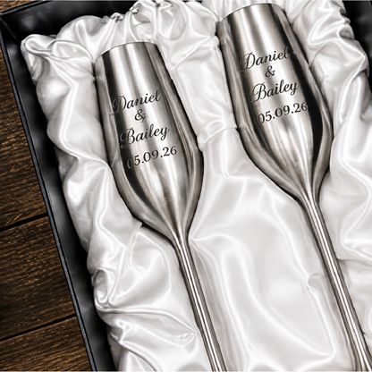 Silver personalized champagne flutes in the box