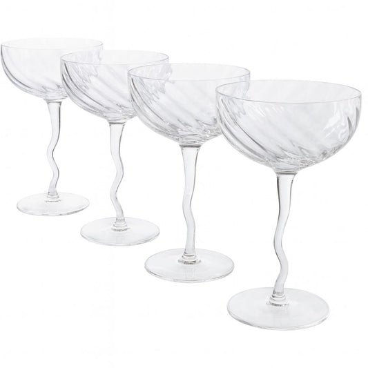 Set of four clear glass cocktail glasses on a white background