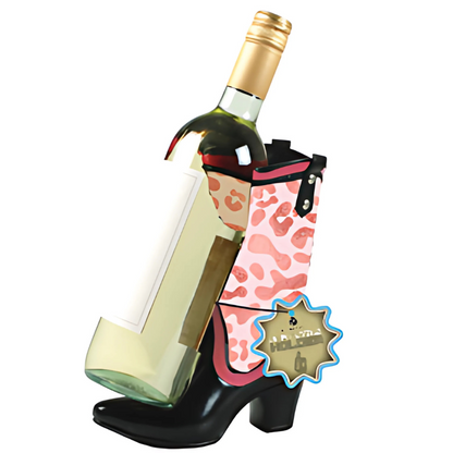 Wine bottle holder shaped like a black high-heeled shoe with pink leopard print design on a white background.